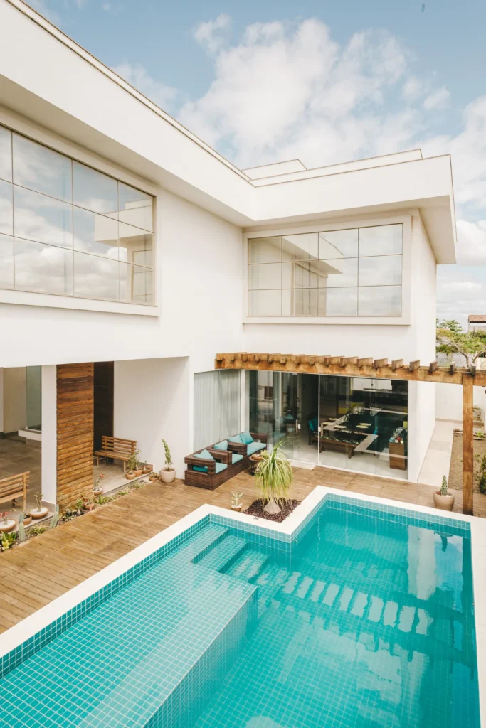 Modern luxury property with indoor and outdoor living spaces and a pool